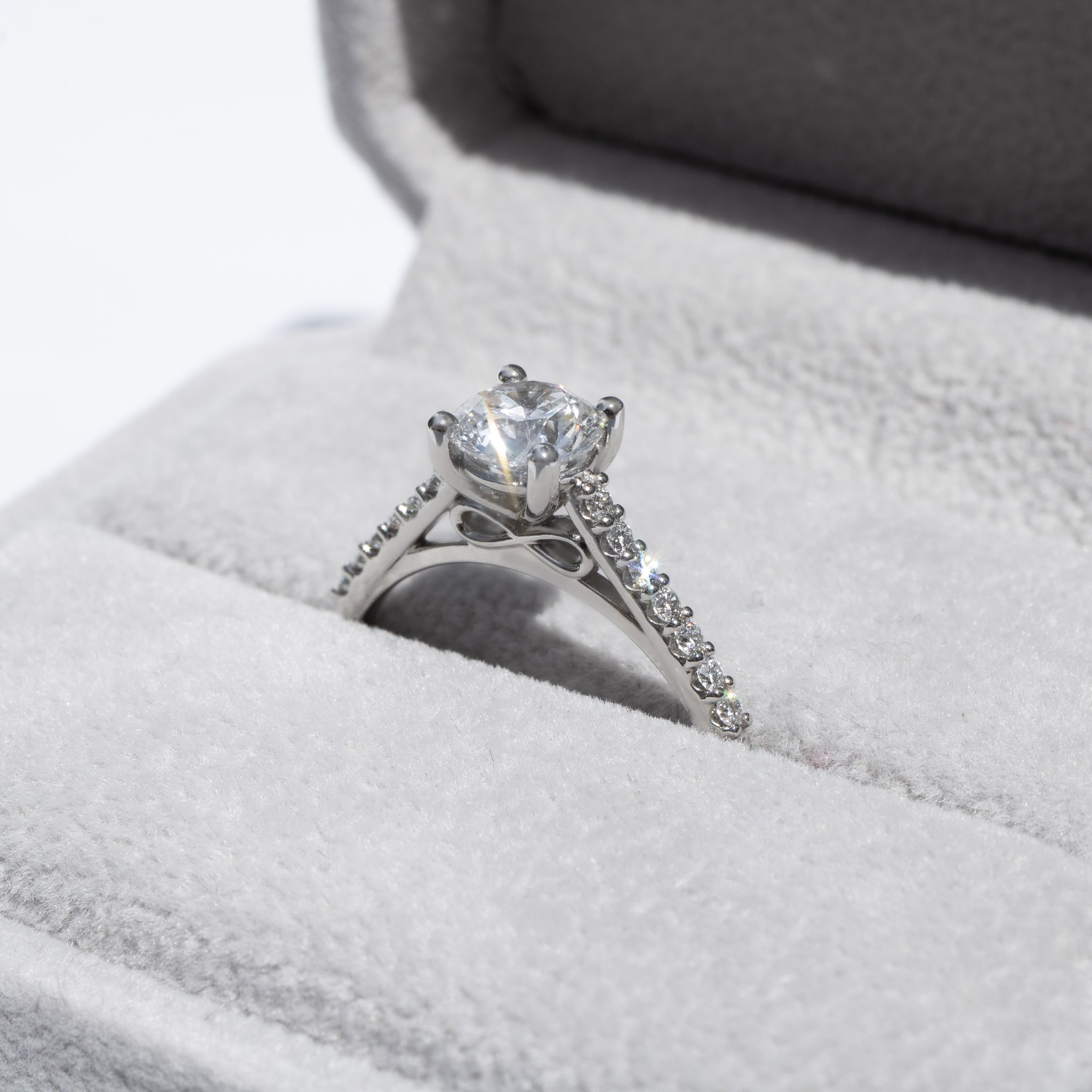 Bespoke Diamond Engagement Ring with Infinity Symbol and Diamond Shoulders