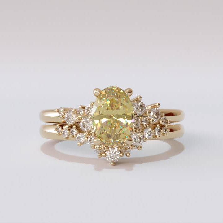 Aries fitted curved wedding band with asymmetric graduated diamonds, designed to nest with a pear-cut engagement ring